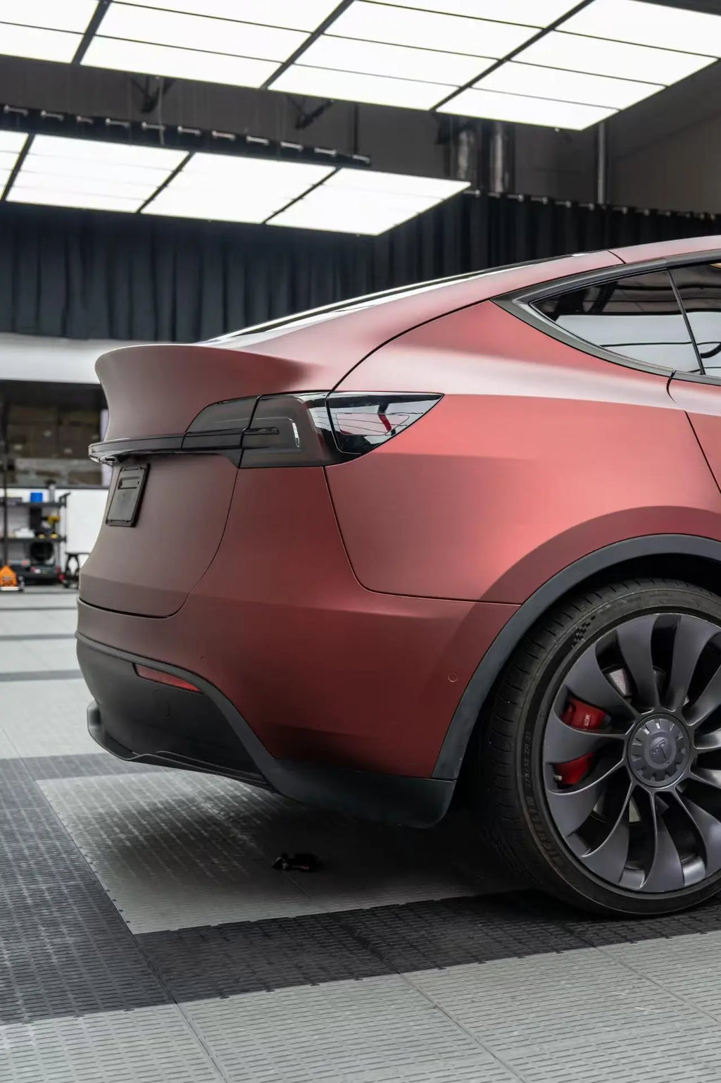 Satin Chrome Silk Red vinyl on Tesla Model Y right rear quarter panel - elegant matte metallic finish - Kaleido
