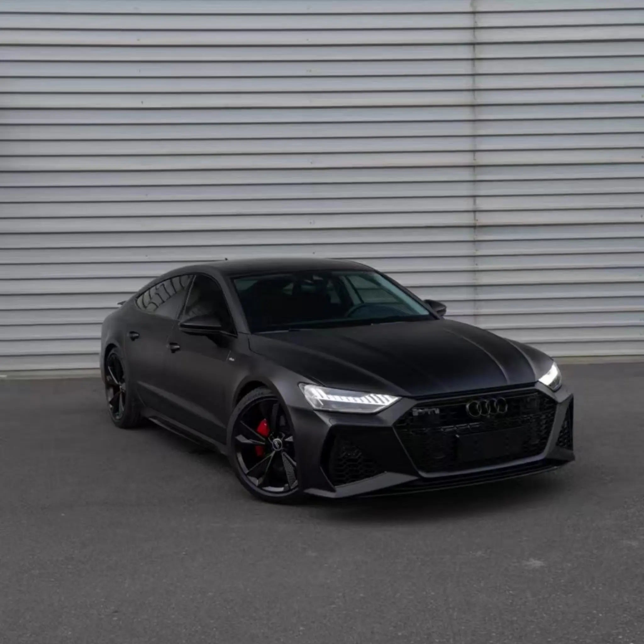 Wide front-right view of an Audi RS7 Sportback (C8) in Satin Chrome Vantablack wrap - Kaleido