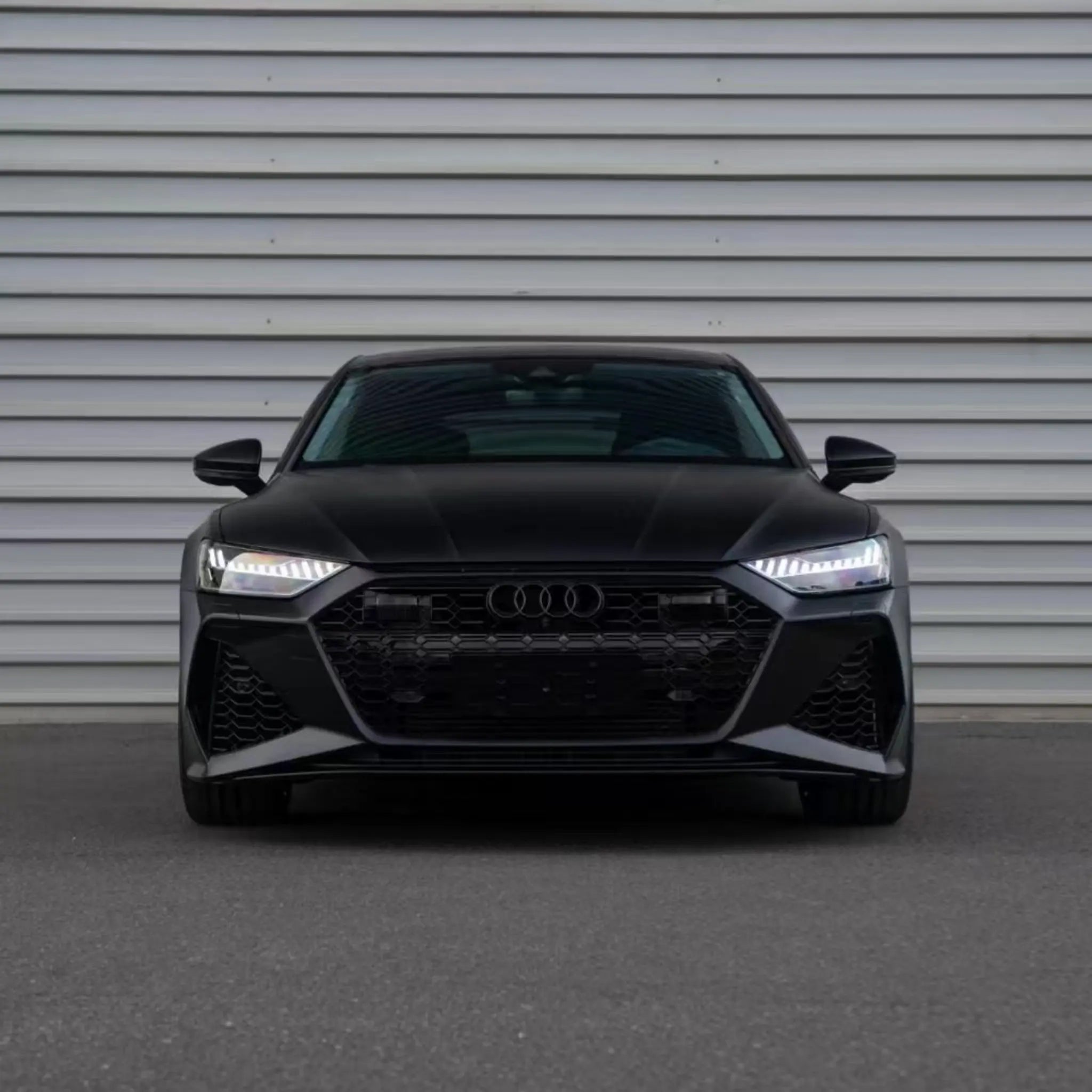Front view of an Audi RS7 Sportback (C8) wrapped in Satin Chrome Vantablack - Kaleido