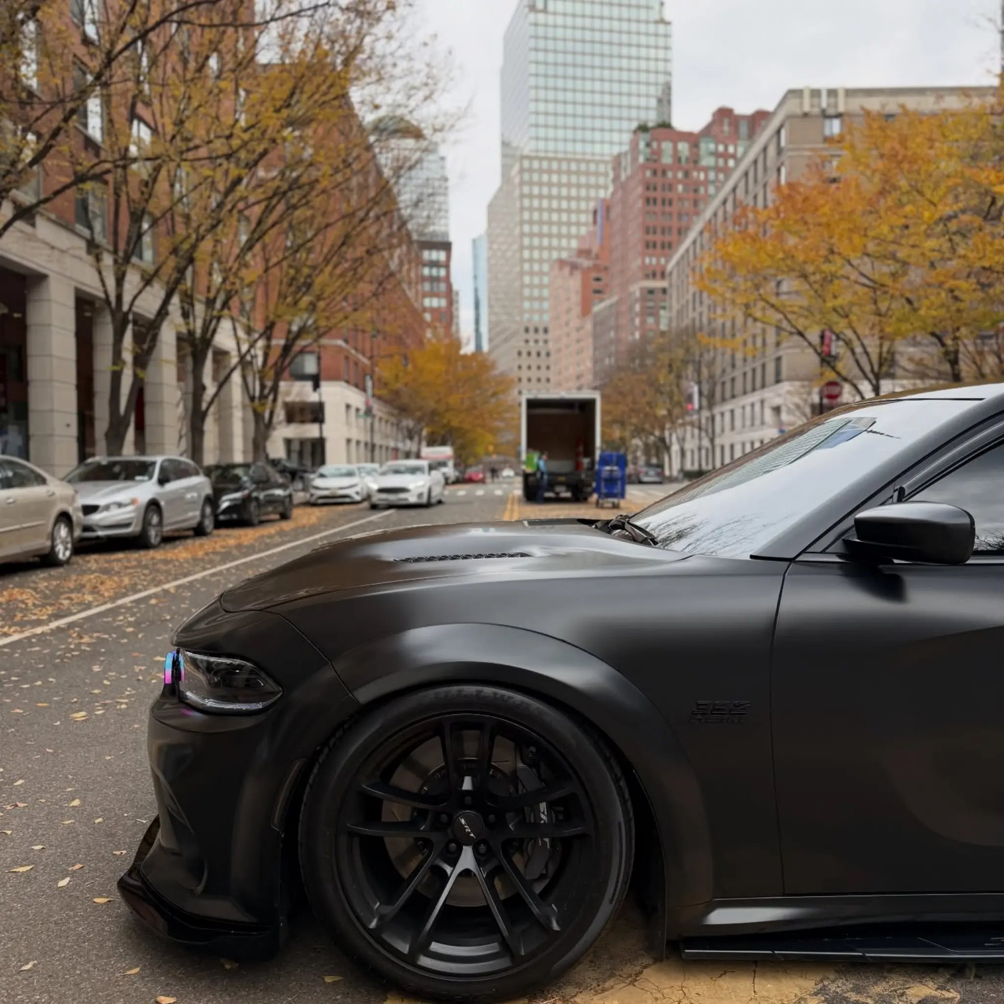 Satin Chrome Vantablack vinyl on the front-left corner of a widebody Dodge Charger SRT - Kaleido