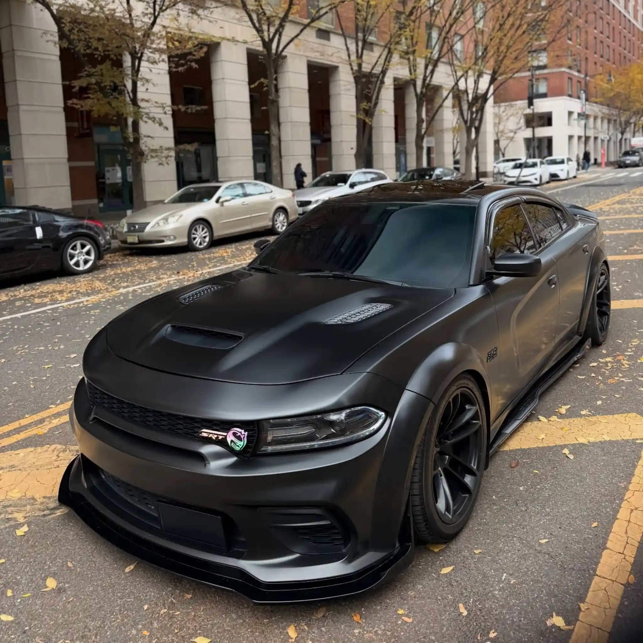 Wide front-left view of a Satin Chrome Vantablack wrapped widebody Dodge Charger SRT - Kaleido