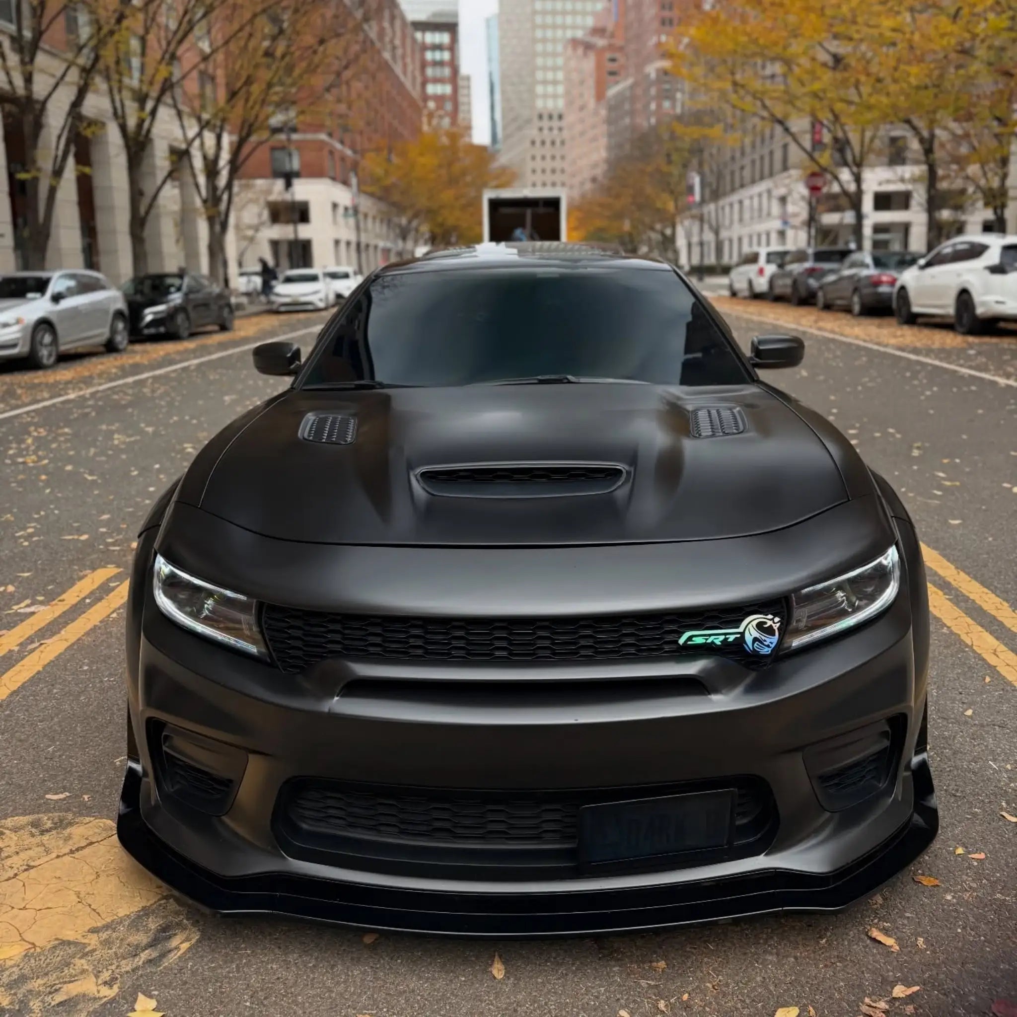 Front view of a widebody Dodge Charger SRT in Satin Chrome Vantablack wrap - aggressive stance - Kaleido