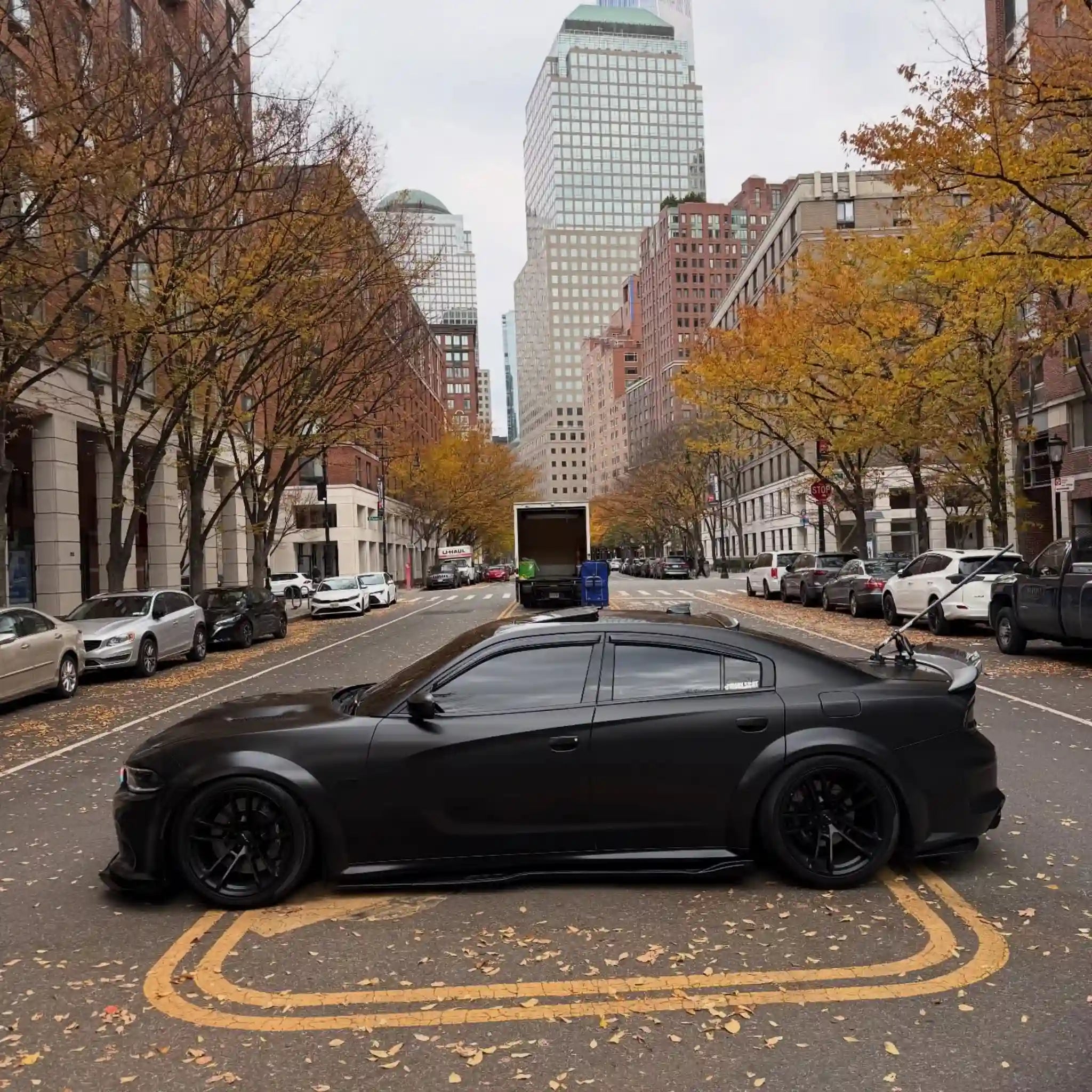 Full left side profile of a widebody Dodge Charger SRT in Satin Chrome Vantablack vinyl - Kaleido