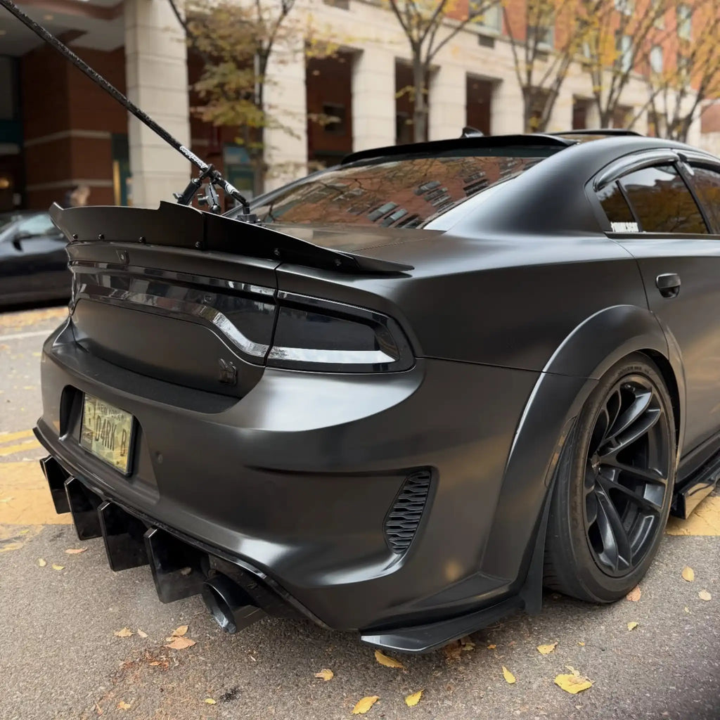 Wide rear-right view of a widebody Dodge Charger SRT in Satin Chrome Vantablack wrap - Kaleido