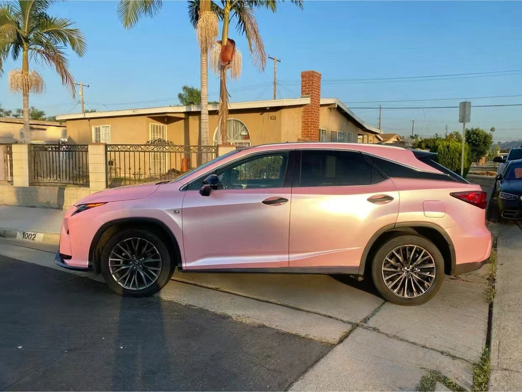 Side profile of a Lexus RX wrapped in Satin Metallic Sakura Pink, highlighting the SUV's silhouette - Kaleido