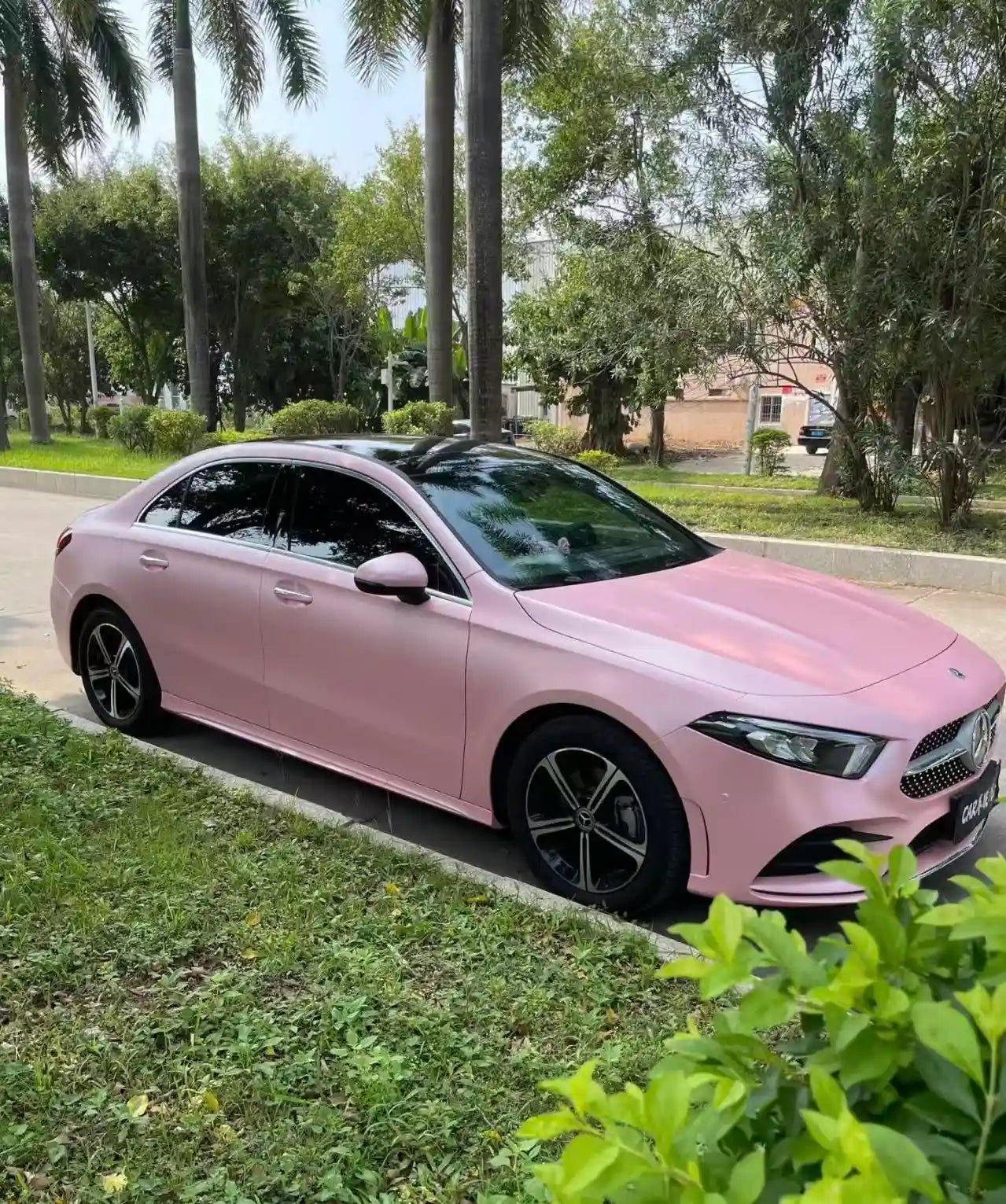 Mercedes-Benz A-Class sedan in Satin Metallic Sakura Pink - front-right angle - Kaleido