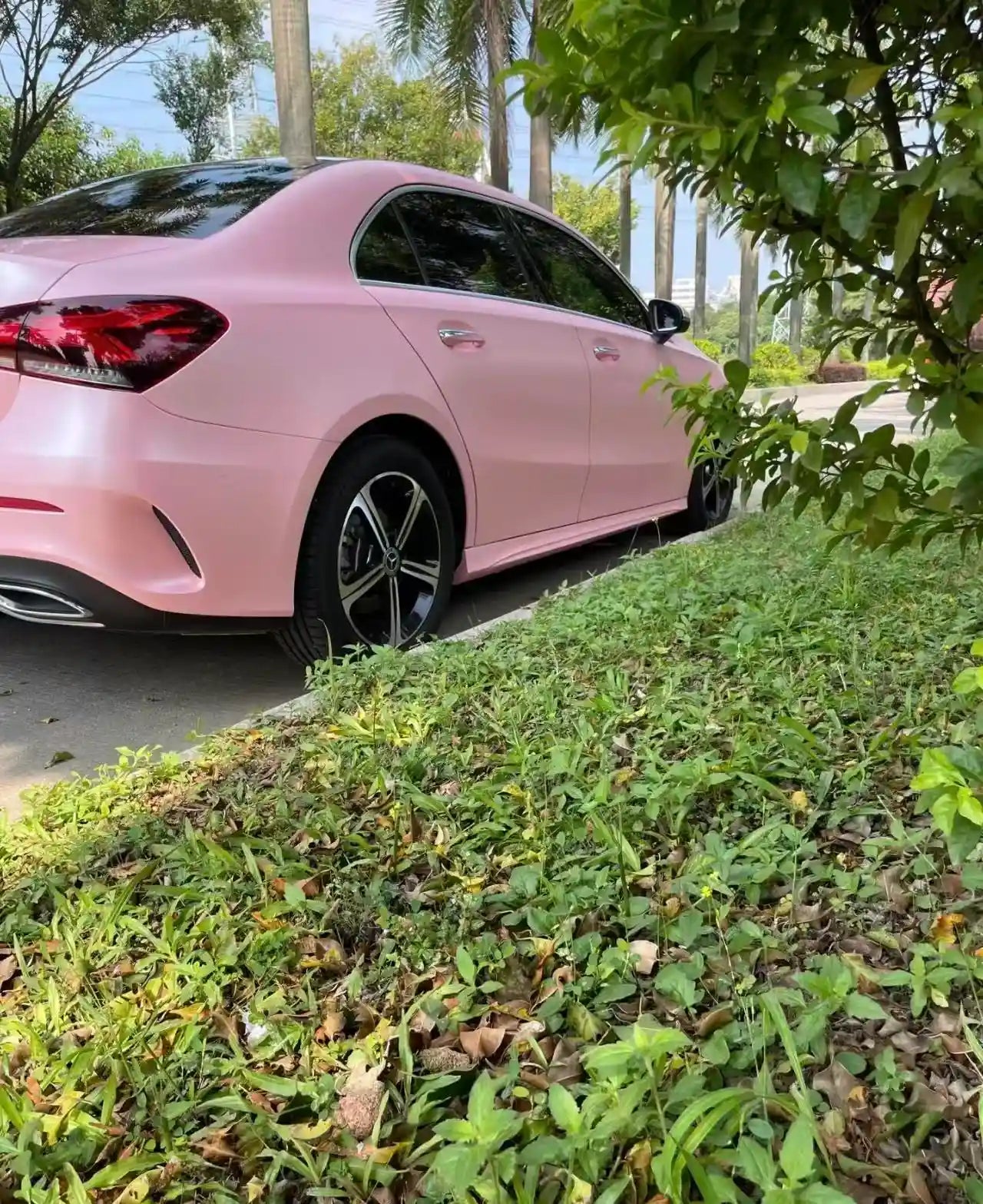 Satin Metallic Sakura Pink film on a Mercedes A-Class sedan - rear-right view - Kaleido