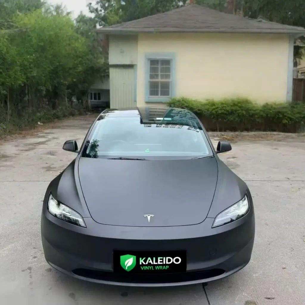 Front view of Tesla Model 3 wrapped in Stealth Matte Black - clean aggressive stance - Kaleido