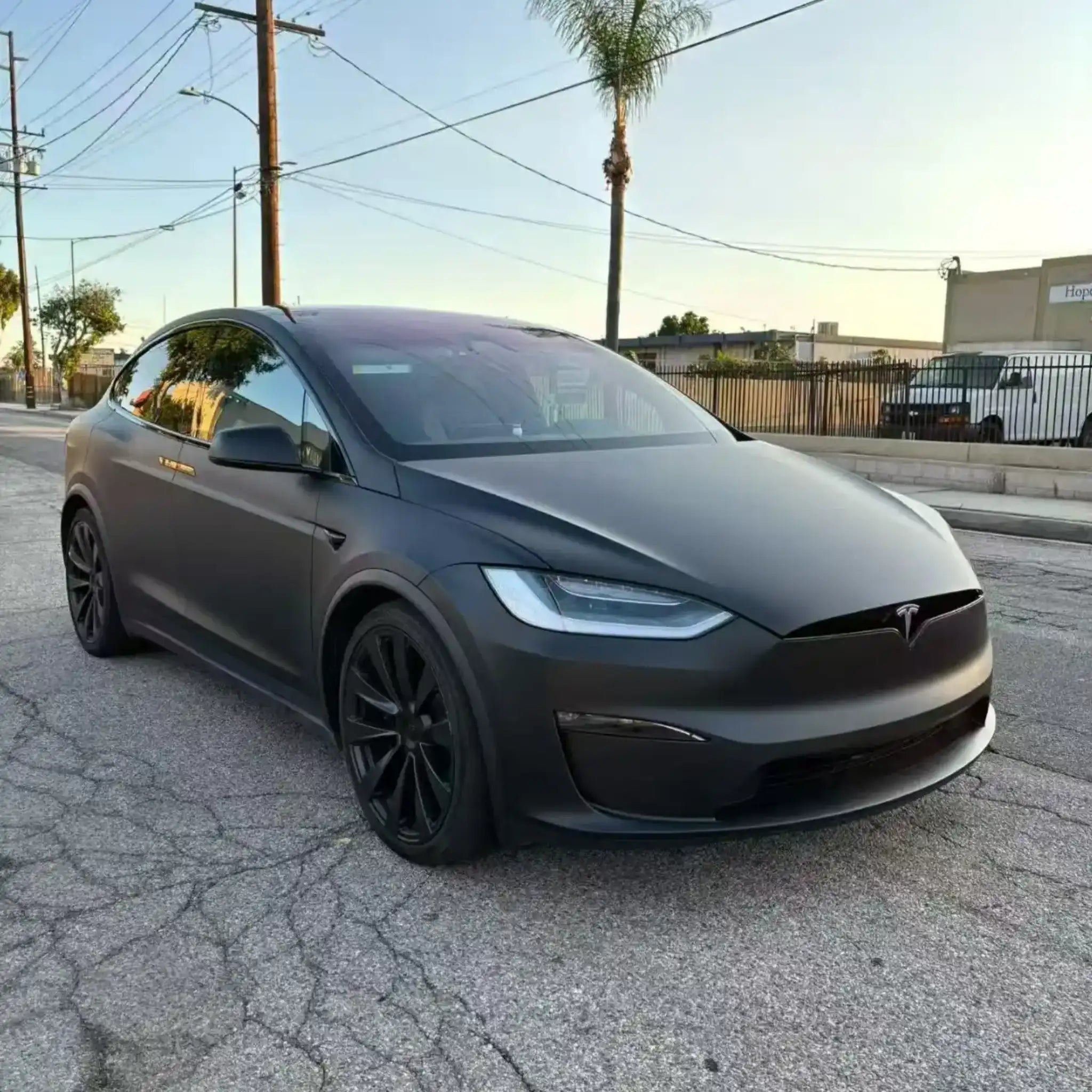 Tesla Model X with Stealth Matte Black film - front-right angle showing matte finish on Falcon Wing doors - Kaleido
