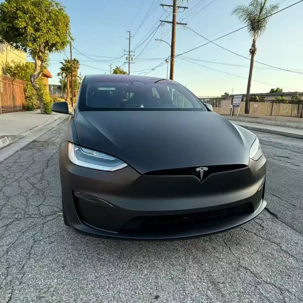 Close-up front view of Tesla Model X in Stealth Matte Black wrap - Kaleido