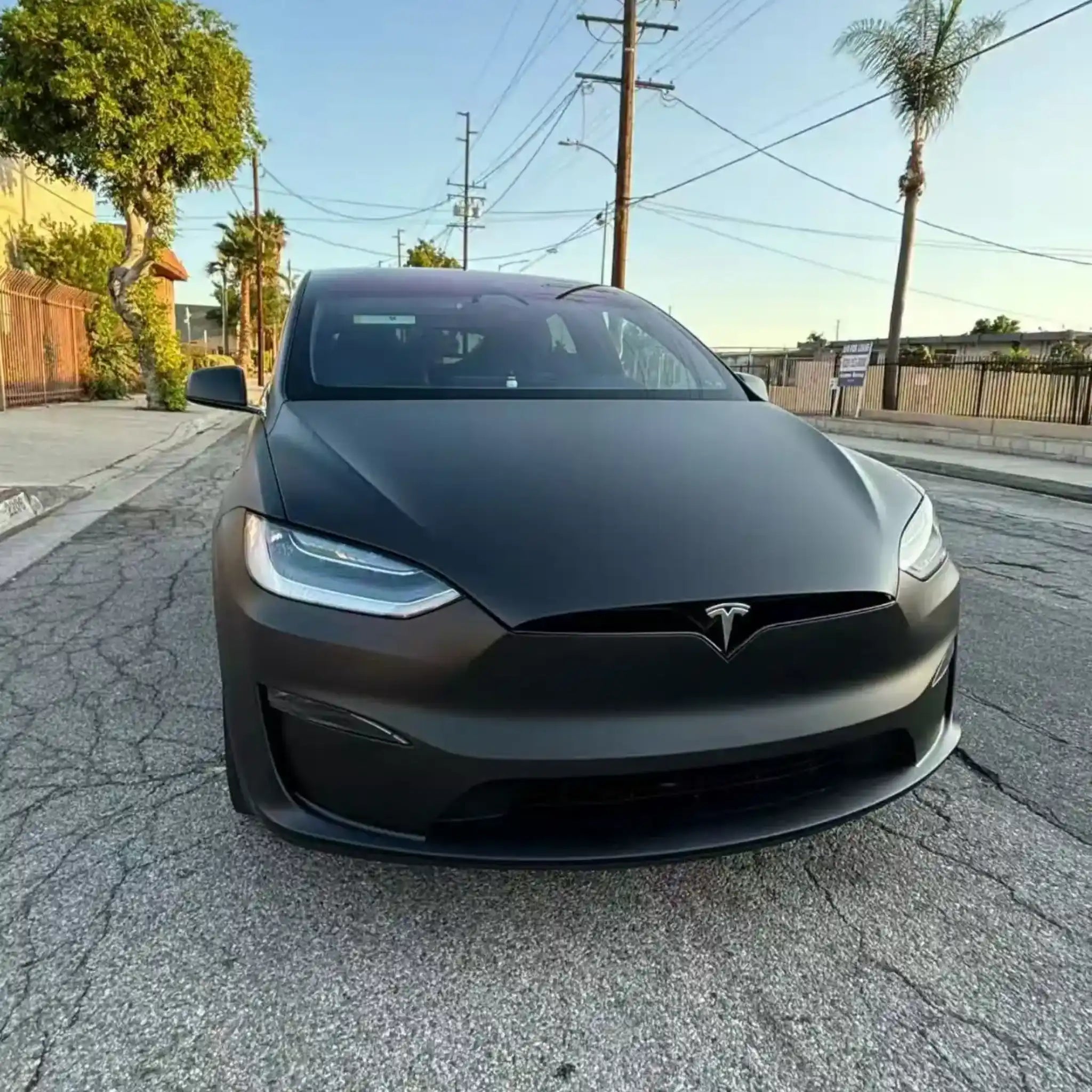 Close-up front view of Tesla Model X in Stealth Matte Black wrap - Kaleido