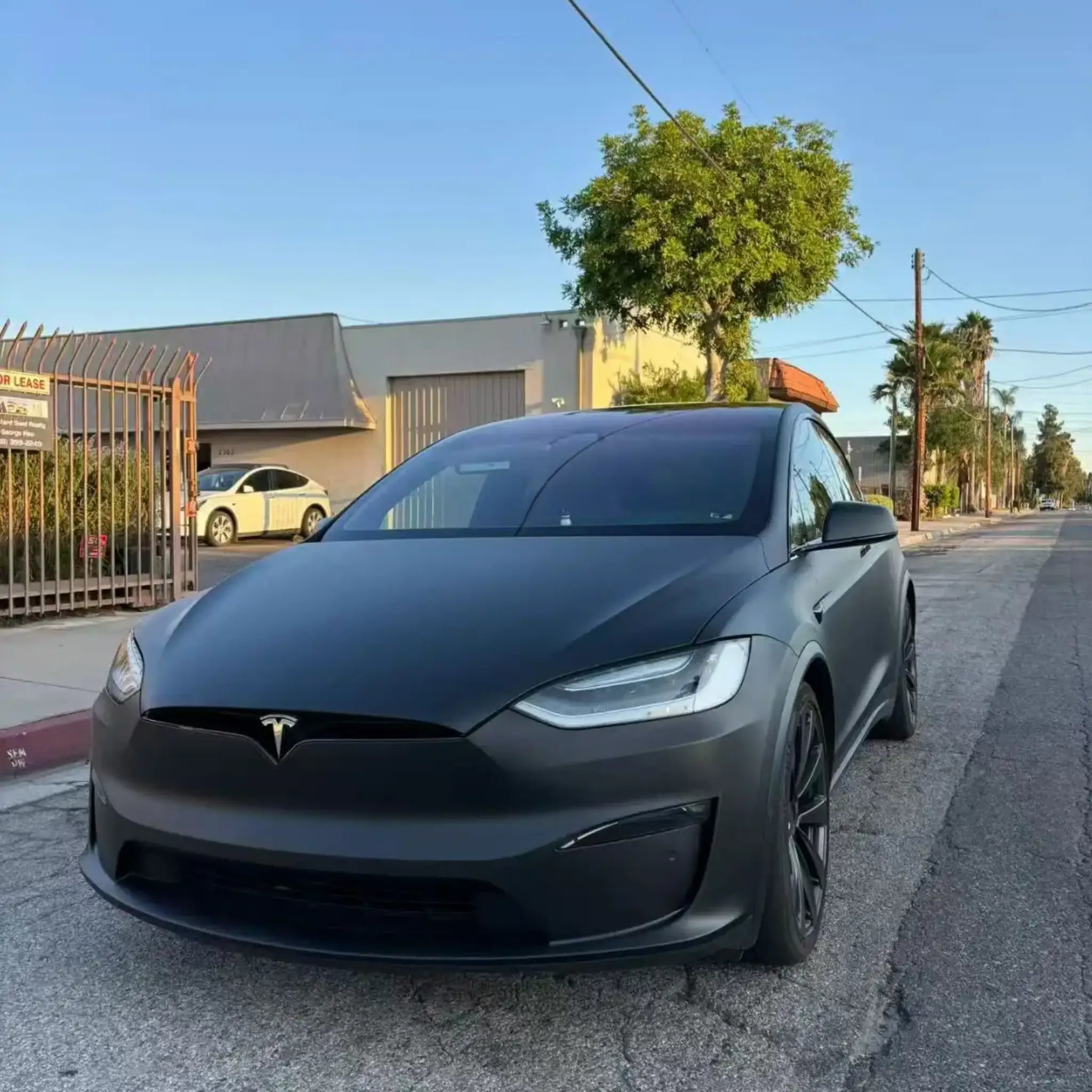 Front view of Tesla Model X in Stealth Matte Black vinyl wrap - full front fascia - Kaleido