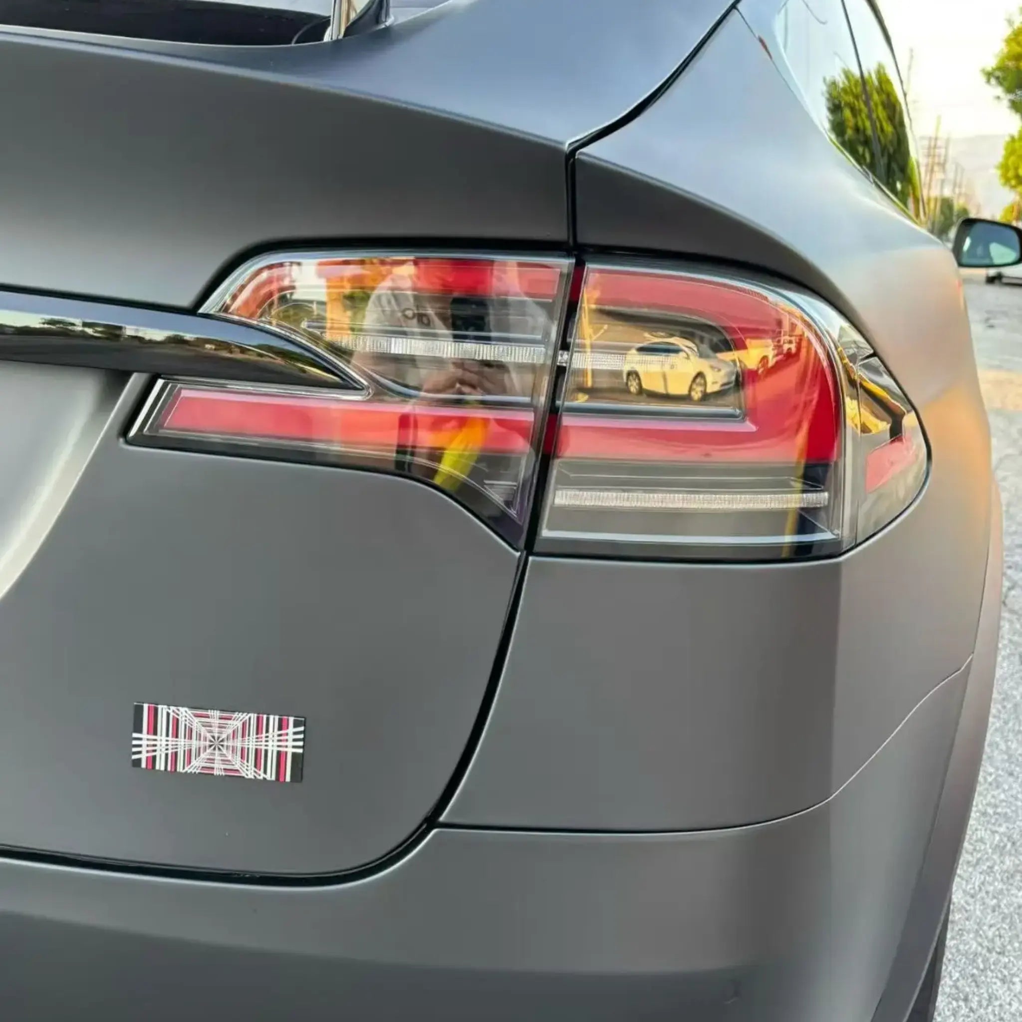 Stealth Matte Black wrap on Tesla Model X right rear side - SUV tailgate area - Kaleido