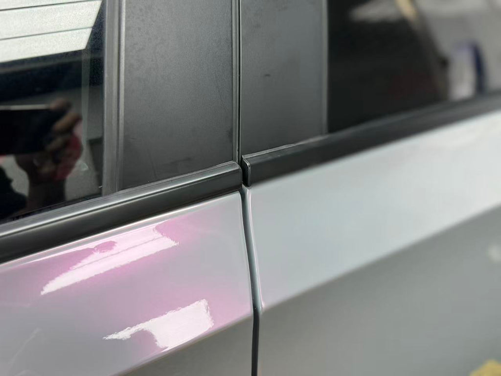 Macro shot of Volcanic Aura wrap on Honda Civic door - showing grey to pink flakes - Kaleido